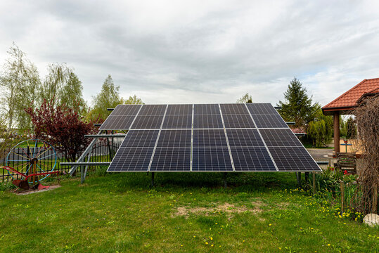 Photovoltaic panels generating clean energy in a polish garden