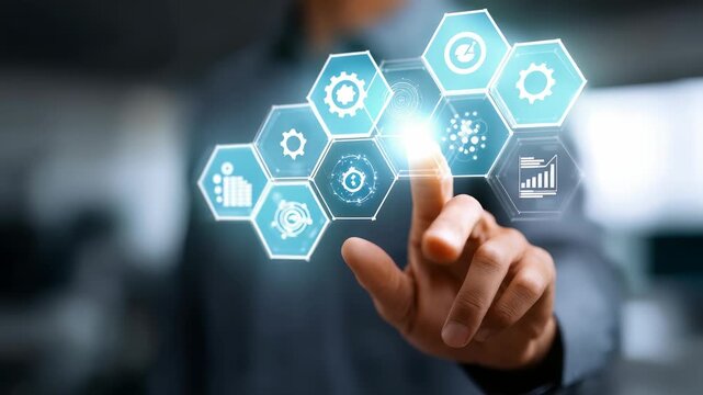 Closeup hand interacting with transparent digital screen featuring technology icons, symbolizing smart solutions. Highlights innovation, automation, digital transformation in business environments