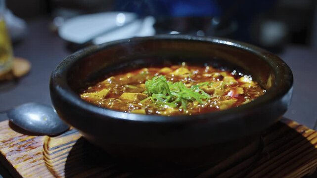 Boiling Delicious Mapo Tofu, Spicy Chinese Dish with Chili Oil, Tofu and Meat