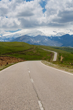 Road to the Dzhily Su against the backdrop of Elbrus in Caucasus mountains