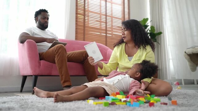 Family enjoying quality time together playing with colorful blocks indoors
