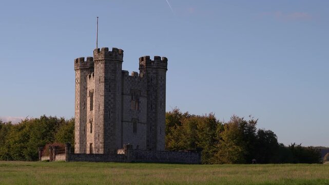 Hiorne's Tower at Arundel Park in West Sussex at sunset with large autumn tree