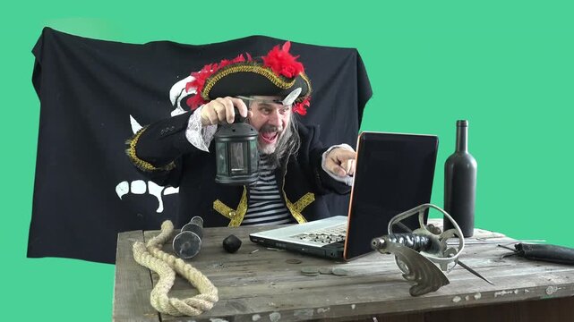 Costumed pirate with eye patch and Jolly Roger skull flag reacts expressively at laptop desk &mdash; thumbs up, pointing, triumphant. Chroma key background. Cybercrime, hacking success, digital fraud concep