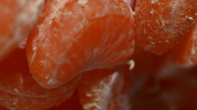 Mandarin Slices Spinning on Plate. Top-Down Seamless Citrus Loop, Fresh