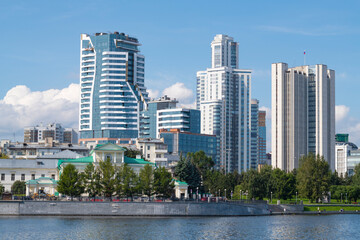 View of modern high-rise buildings from the Iset River on a sunny August day. Yekaterinburg © sikaraha