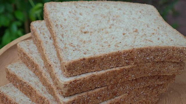 Whole wheat bread on wooden 