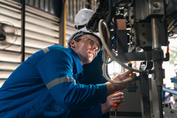 Fototapeta premium Welding robotic industrial automation engineer factory technology manufacturing steel machinery precision production innovation system technician equipment control modern process