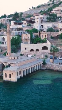 Vertical Video Aerial View of Halfeti Waterfront with Historic Mosque