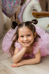 Fototapeta premium Happy little girl in a ballerina costume
