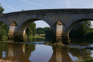 Fototapeta premium Historic Pont Vieux Bridge Under Glowing Twilight Skies, Evoking Tranquility and Timeless Charm
