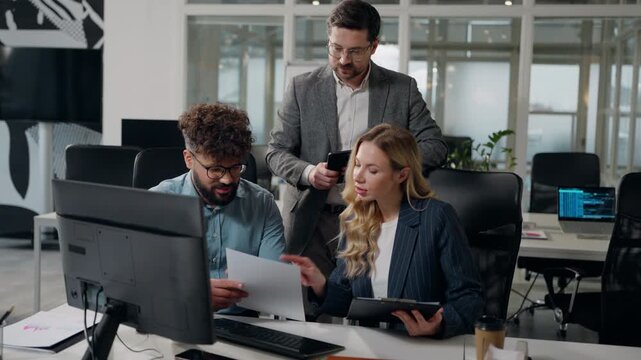 Group diversity employers business team talking discussing papers work reviewing documents digital tablet in corporate office discuss financial strategy paperwork three multiethnic analysts talk work