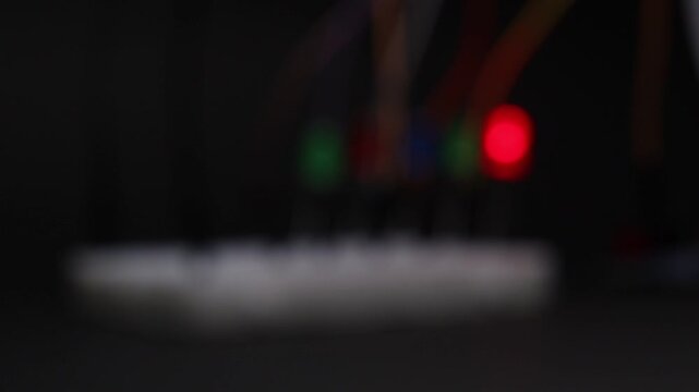 Breadboard circuit with led and jumper wires. Green and red LED glowing on a blur background