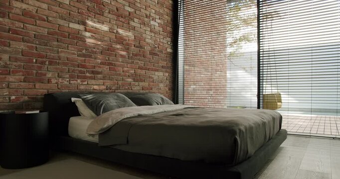Elegant modern bedroom featuring a large comfortable bed, exposed brick wall, and wide windows offering a tranquil ocean view. Perfect for design inspiration. Modern Bedroom with Brick Wall