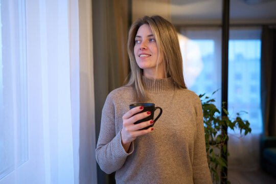 Warm windowside pause with soft morning comfort