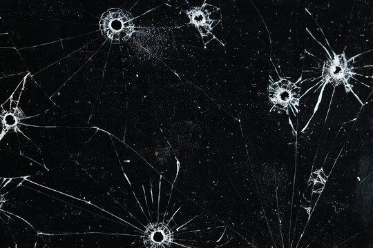 Bullet holes on black glass, overlay design background