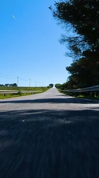 POV point of view first person view driving on a empty landscape road in summer - Vertical Video