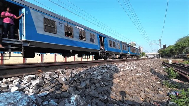 A local suburban commuter train in the countryside  near Pune India.
