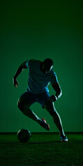 Soccer player dribbling ball in dark green studio sport scene. Concept of football agility, speed training, athletic gear campaign, coaching content and match preparation. © Lustre Art Group 