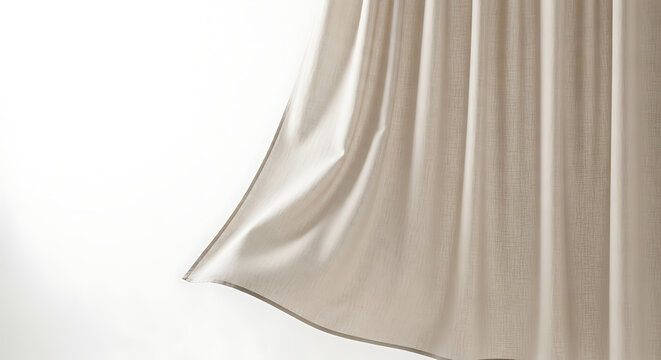 A close up of a beige curtain with vertical folds against a white background in a studio setting