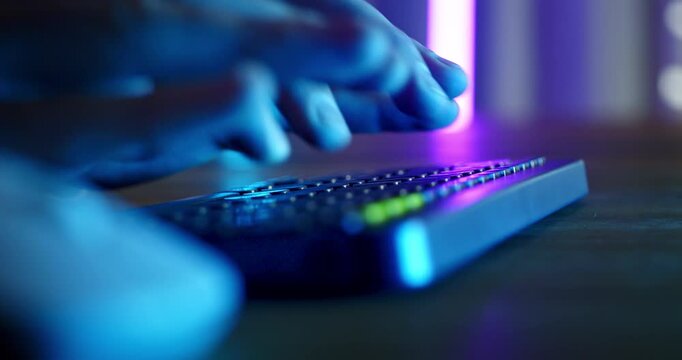 Slow Motion Of Hands Operating Audio Mixer And Computer Keyboard In Neon Studio, Music Production And Sound Engineering Concept
