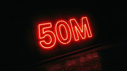 Obraz premium Glowing red neon sign displaying fifty million milestone for social media followers or financial goals.