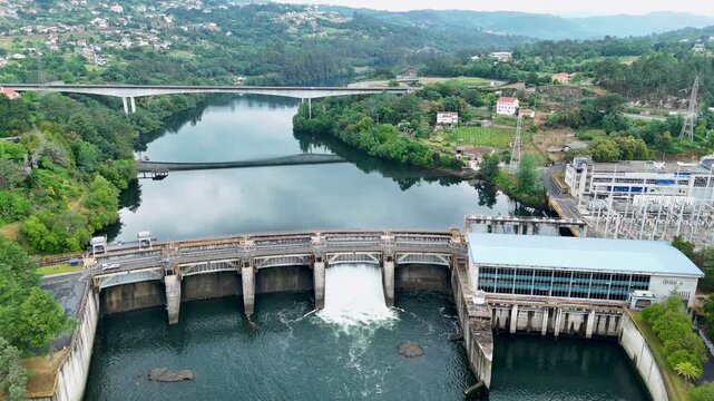 Aerial view of hydroelectric dam power plant releasing water
