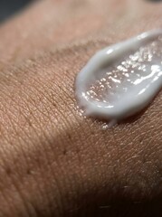 Fototapeta premium Extreme macro detail of mosquito repellent lotion applied on hand