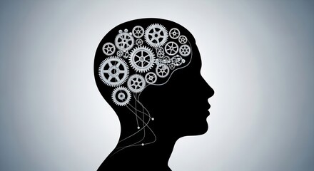 Obraz premium A black silhouette of a person's head against a light gray background, with gears and cogs representing the mind.