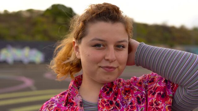 Happy curvy girl smiling and posing in front of camera - Diversity, young woman and style concept