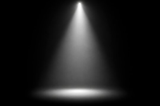 Dramatic spotlight beam illuminating dark void, cinematic lighting effect for film production, abstract gradient light cone against black background, moody atmosphere concept