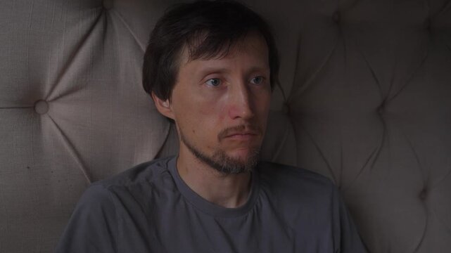 Middle aged man growling with closed mouth, high quality audio recording. Deep vocal vibration and expressive human sound. Emotion, tension and creative sound design concept.