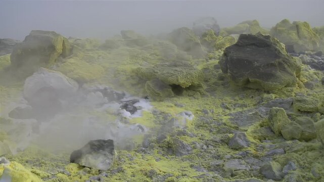 Sulfur fumaroles and chloride crusts on the crater rim, geothermal activity on the slopes of Vulcano Islands, Italy. 