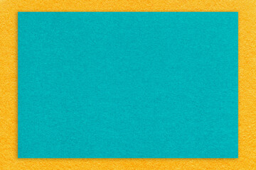 Fototapeta premium Texture craft turquoise paper background with yellow border, macro. Structure vintage cerulean cardboard
