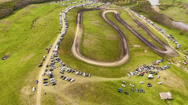 Auto Cross Race on Dirt Track Seen from Above, Aerial Sports Concept with Racing Cars and Dust Clouds, Drone View of Off-Road Competition
