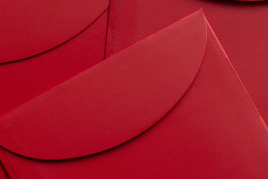 Top view of red paper envelopes with curved flaps background,Macro,Traditional Red and Gold Envelopes for Chinese New Year Celebration