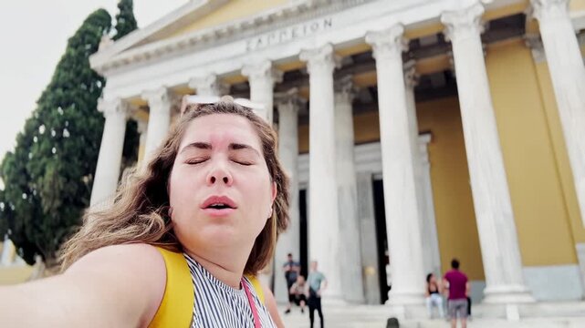 Vlogger Woman Squinting at Zappeion Hall in Bright Athens Sun
