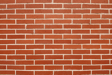 Fototapeta premium Mur en briques rouges de construction, utilisé en maçonnerie pour les bâtiments.