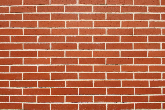 Mur en briques rouges de construction, utilis&eacute; en ma&ccedil;onnerie pour les b&acirc;timents.