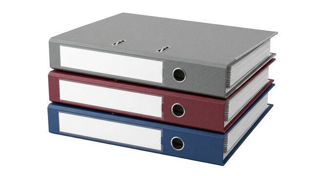 High angle view of a stack of three colored office ring binders with blank labels isolated on a solid black background
