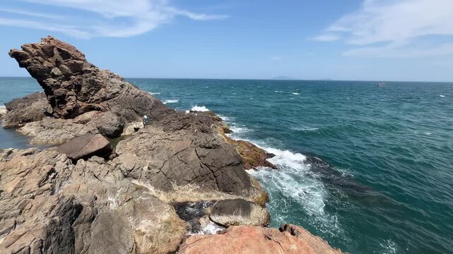 Wide view of the blue ocean horizon from the cliffs of Son Tra Peninsula near Lion Rock, Da Nang. Calm tropical seascape.