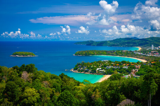 Beautiful turquoise ocean waves with boats and coastline from high view point. Kata and Karon beaches Phuket Thailand