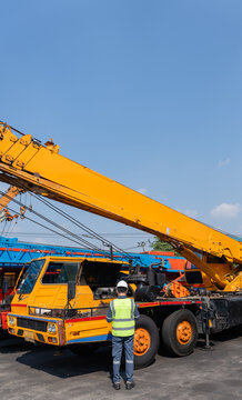 Crane safety inspection worker construction truck equipment boom crane safety inspection worker construction truck equipment boom yard with hard
