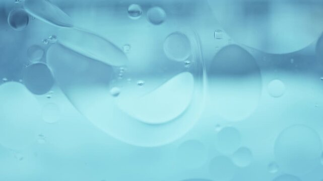 Abstract Oil Droplets Floating on Water, Smooth Fluid Motion Background for Wellness, Skincare and Science Concepts