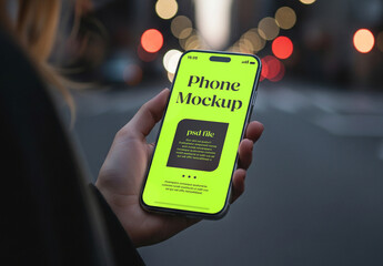 Close up of a smartphone held by hand outdoor at night