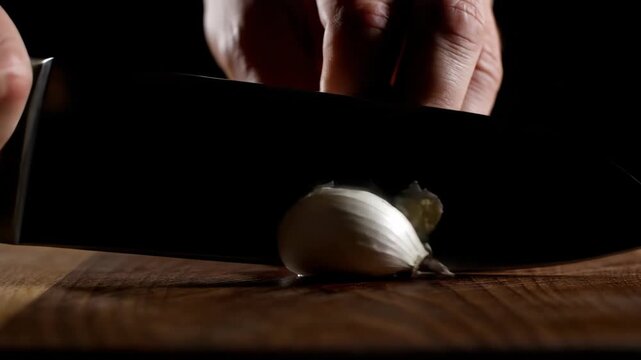Chef Cutting and Preparing Egg on Wooden Surface in Kitchen.
