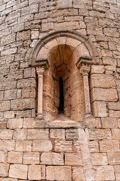 
Stone window of a Romanesque church with a semicircular arch and splayed edge.
Art, architectural, detail, texture