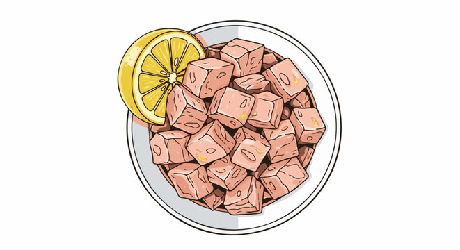 A dish of diced tuna with a slice of lemon