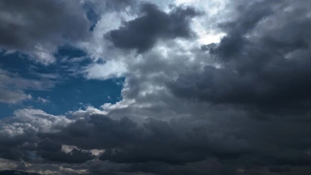 Dramatic Storm Clouds Opening to Blue Sky Timelapse