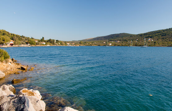 Cozy mediterranean island. Blue lagoon, island paradise. Adriatic Sea of Croatia, popular touristic destination near Primosten. Clear sea water.