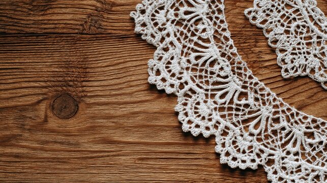 Vintage white lace collar on rustic dark wooden background